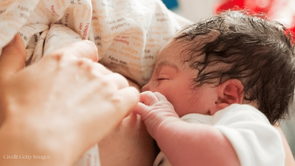 Newborn latching to breastfeed for the first time